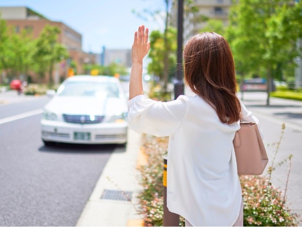 Woman Hailing a Taxi