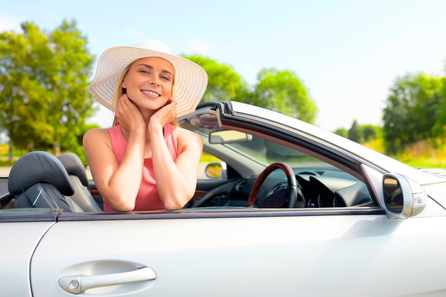 Woman Driving a White Car