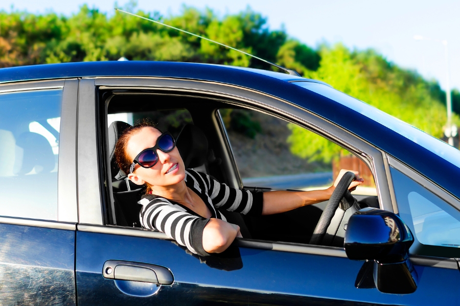 Woman Driving in Nature